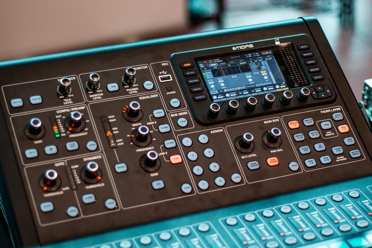 Photo showing audio mixer, console and control panel.