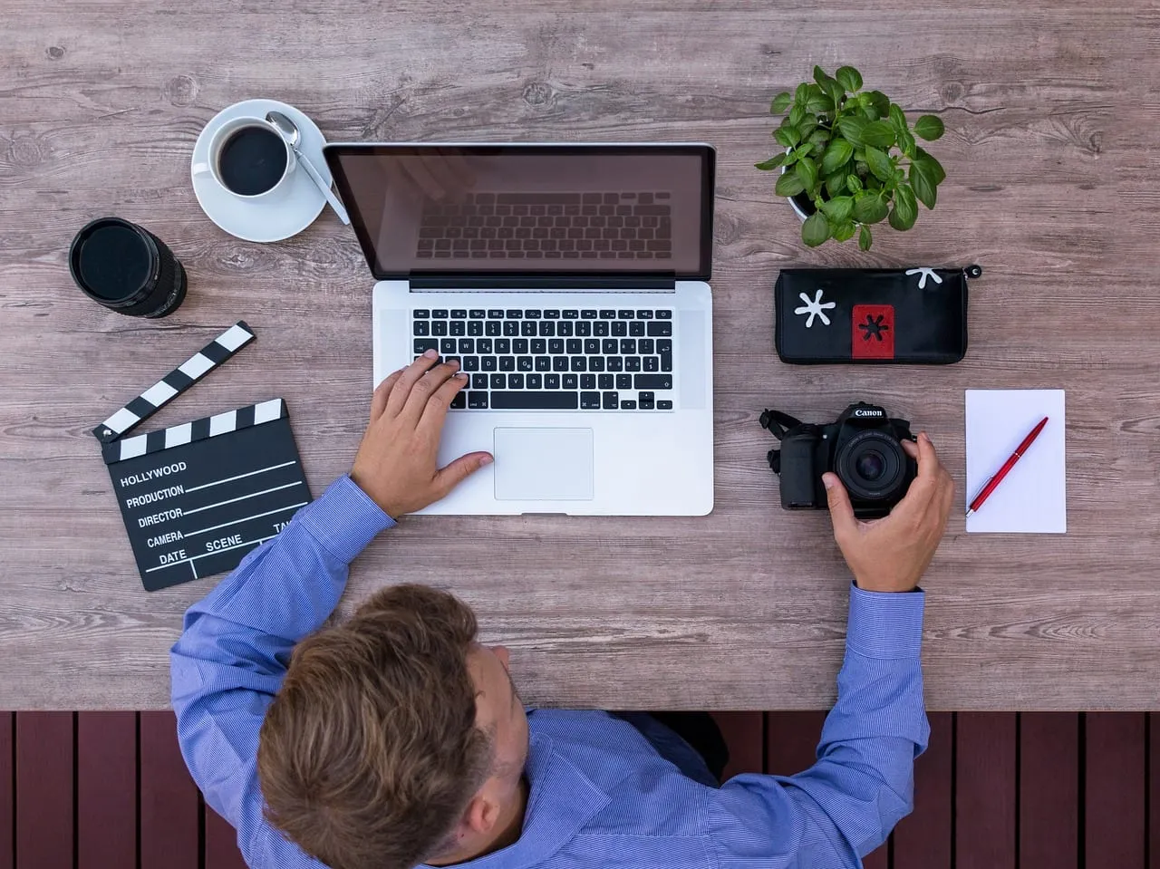 Photo showing youtuber, computer, filmmakers and film producer.