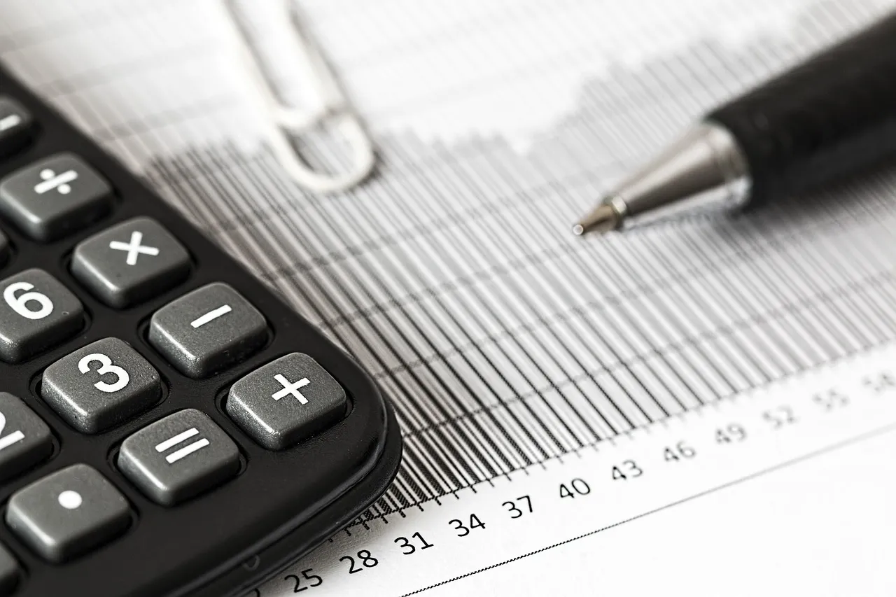 Photo showing new year, calculator, calculation and insurance.