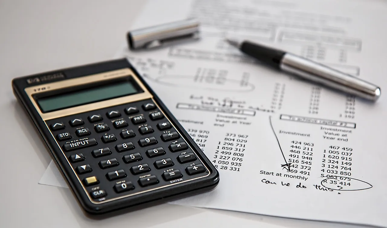 Photo showing calculator, calculation and insurance.