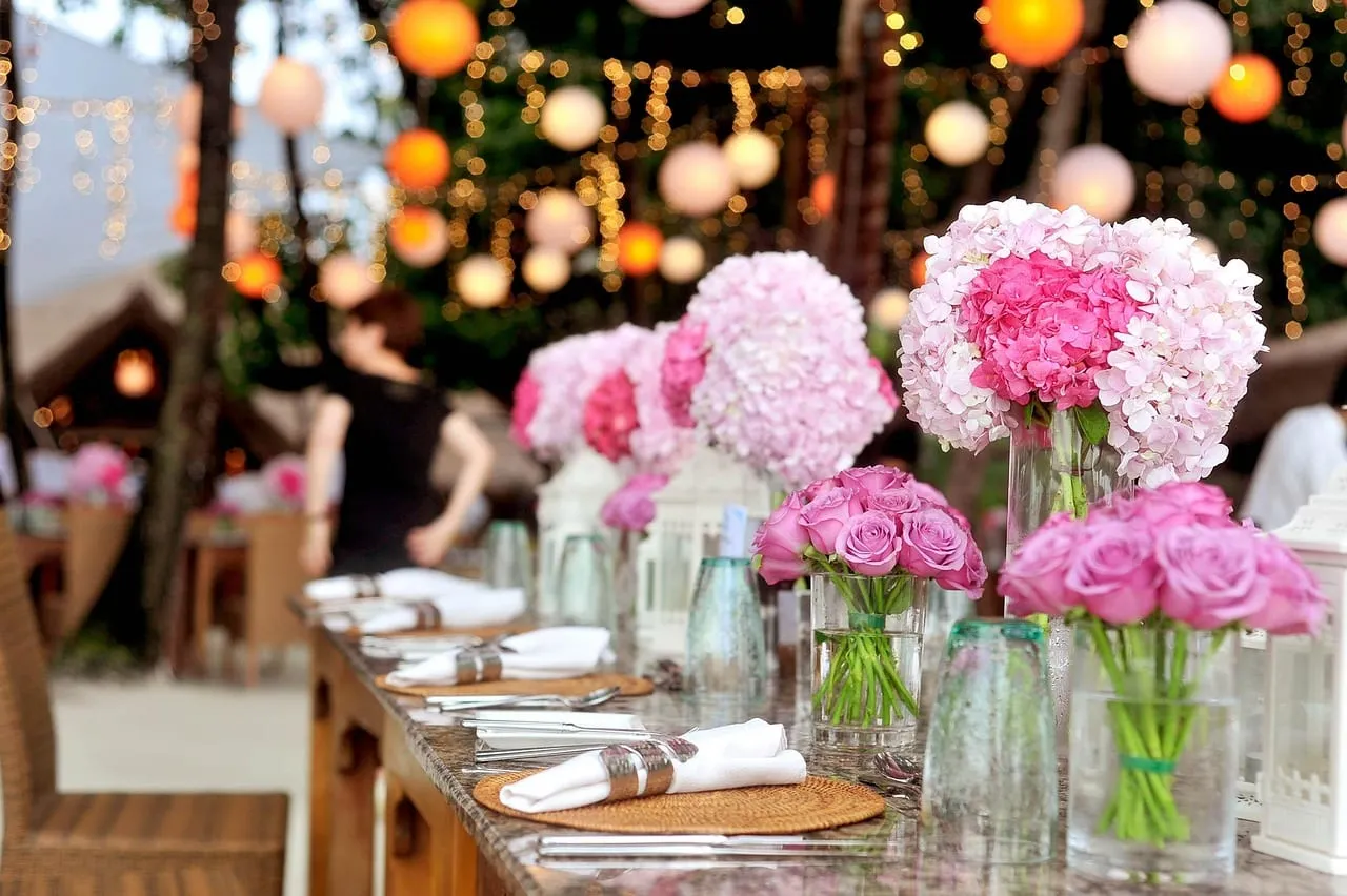 Photo showing wedding, reception, table and nature.