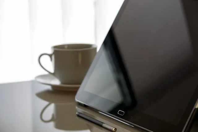 Photo showing tablet, modern office and boss.