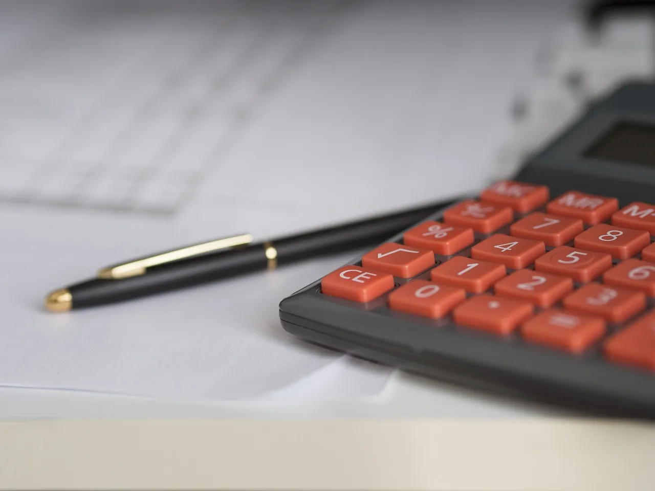 Photo showing business, calculator and calculation.