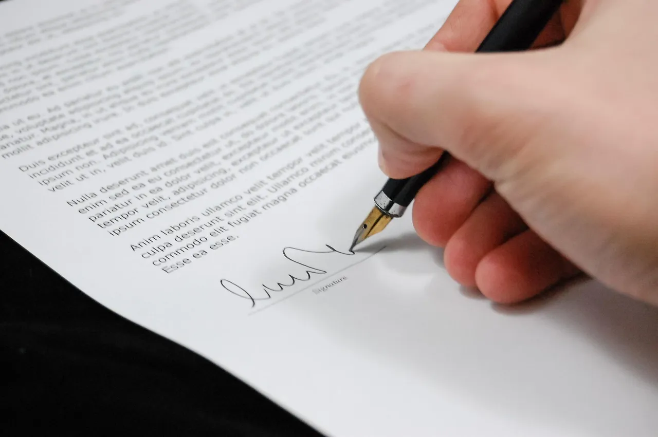 Photo showing document, agreement, documents and sign.