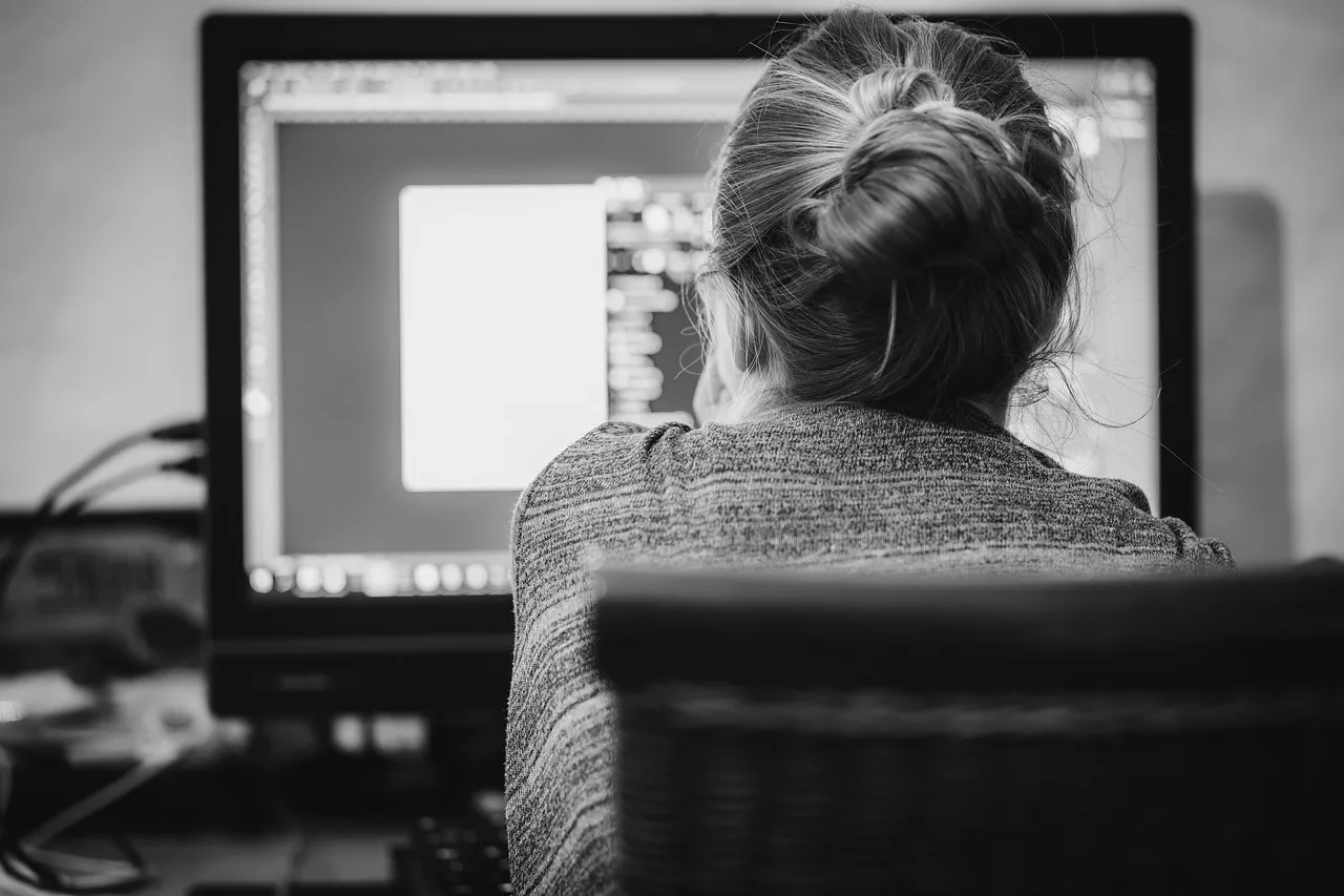 Photo showing home office, person and work.