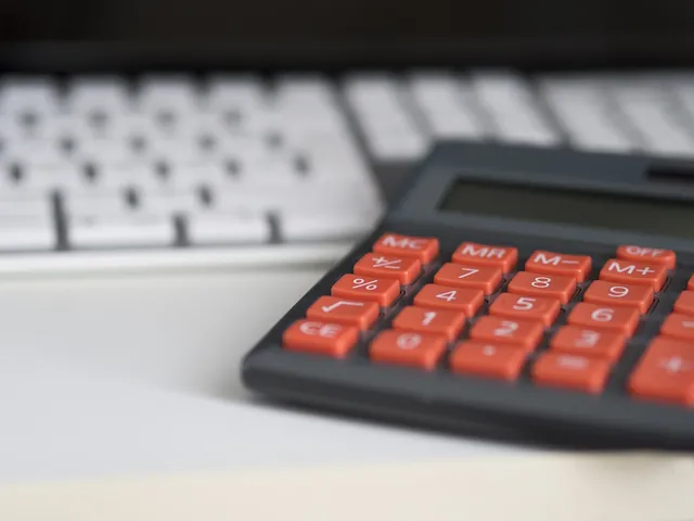 Photo showing business, calculator and calculation.