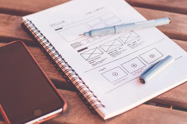 Photo showing plans, design and web design.